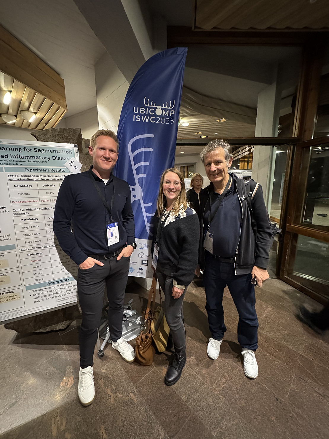 Lars Mathuseck, Dr. Judith Heinisch und Prof. Dr. David auf dem UbiComp Stand
