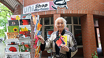 Brigitte Schröder in front of the store.