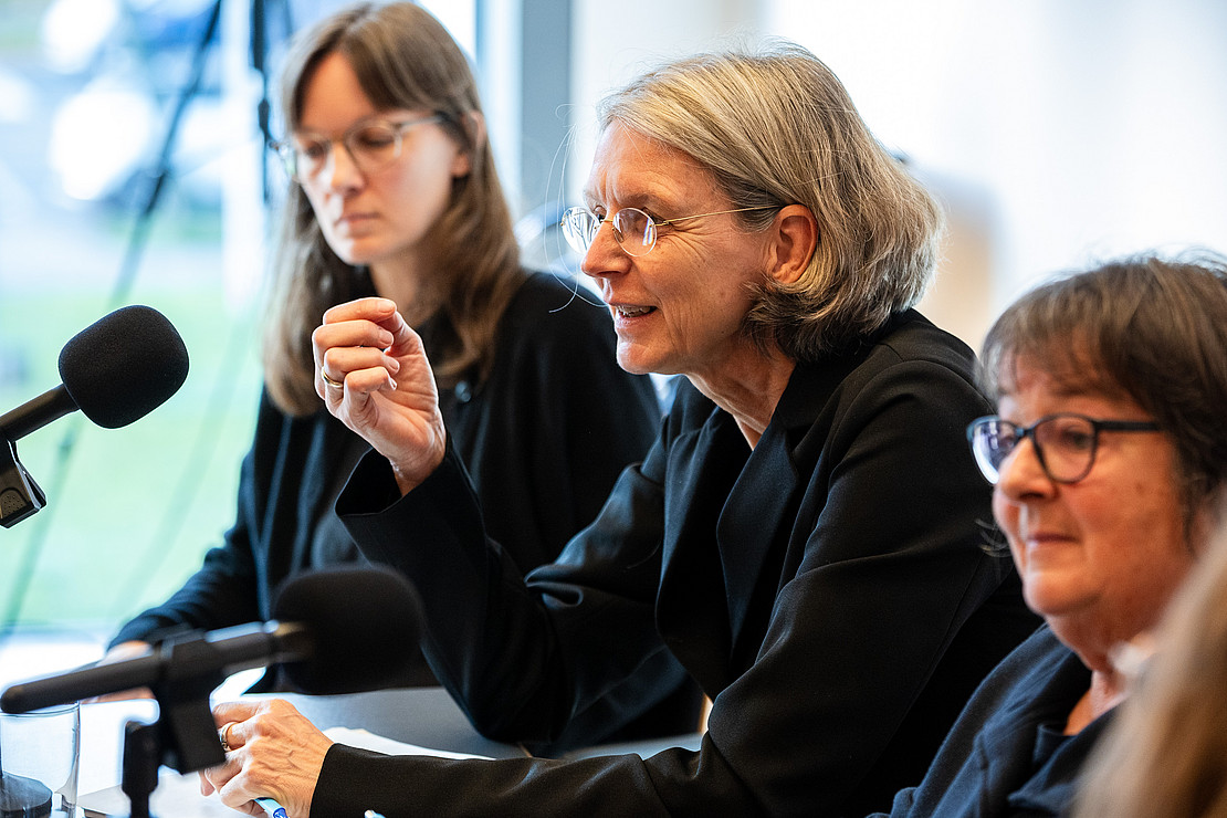 Three women on the podium.