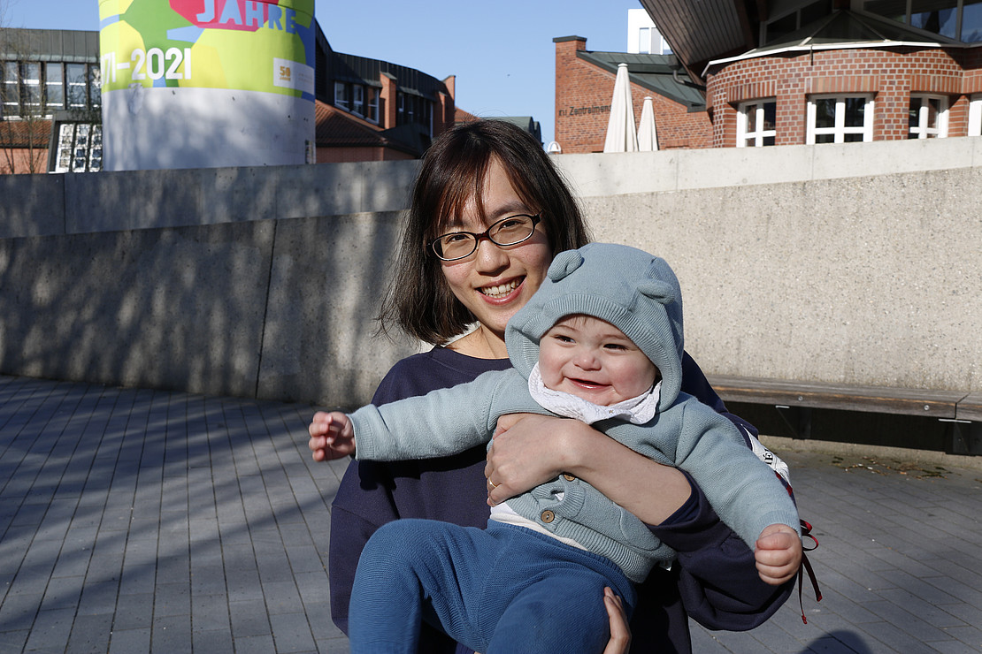 Woman with child in her arms